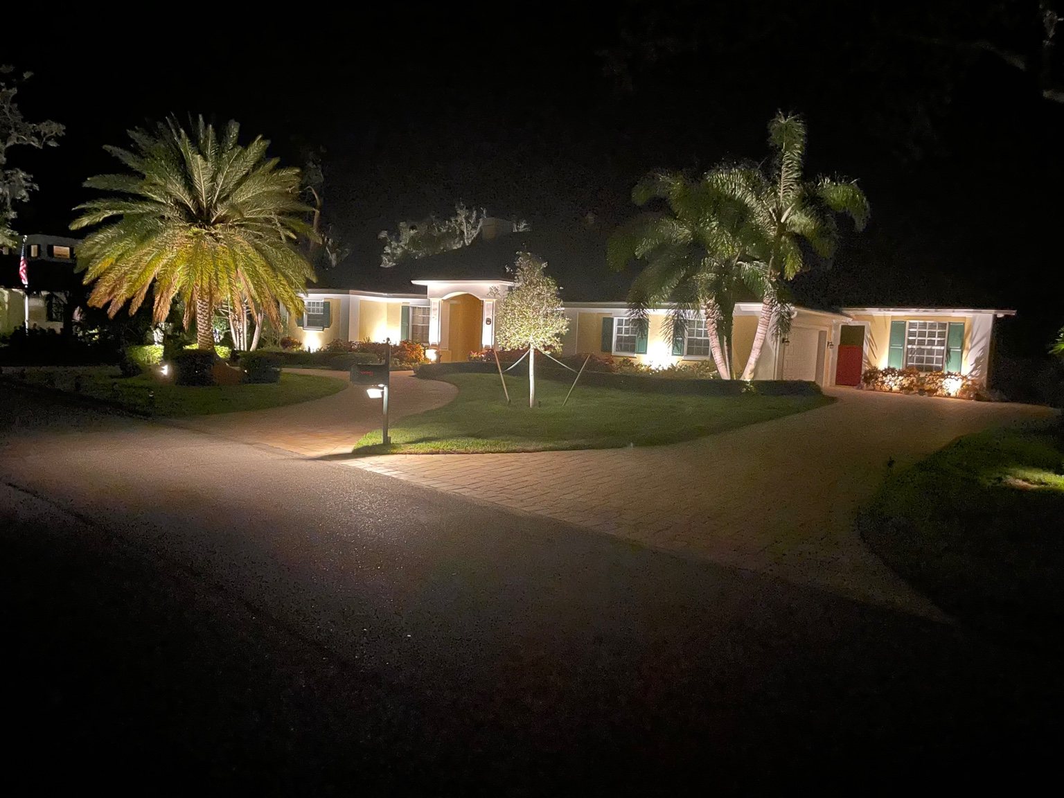 Tropical residence palm and landscape lighting
